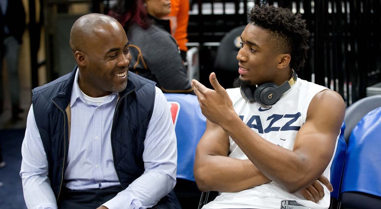 Utah Jazz guard Donovan Mitchell (right) talks with his father Donovan Mitchell Sr. prior to a game against the Golden State Warriors at Vivint Smart Home Arena. Donovan Mitchell with Donovan Mitchell Sr.