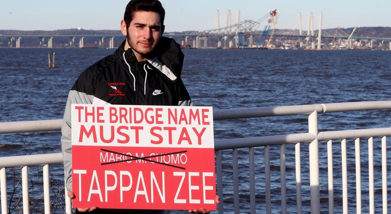 David Dunlop, 17, of Tappan has created a sign that has become popular among those who hope to change the name of the Gov. Mario M. Cuomo Bridge back to the Tappan Zee Bridge. David Dunlop, 17, of Tappan has created a sign that has become popular among those who hope to change the name of the Gov. Mario M. Cuomo Bridge back to the Tappan Zee Bridge.