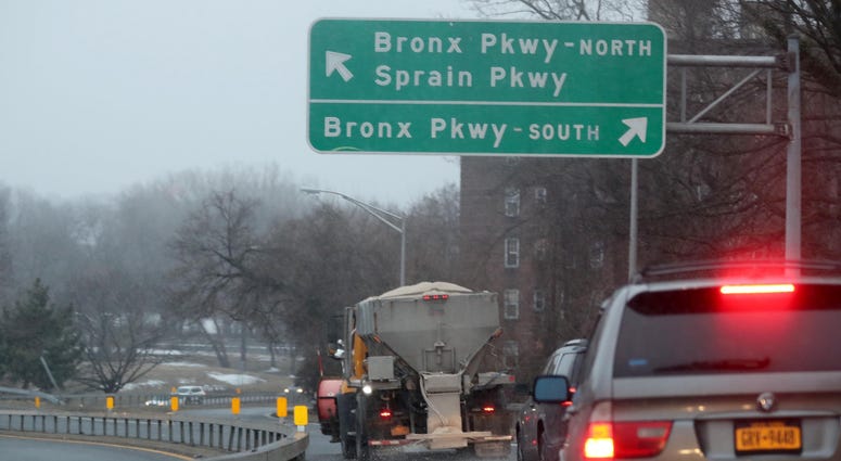 A truck drops salt on the on-ramp to the Bronx River Parkway in Yonkers March, 3, 2019. Bronx River Parkway