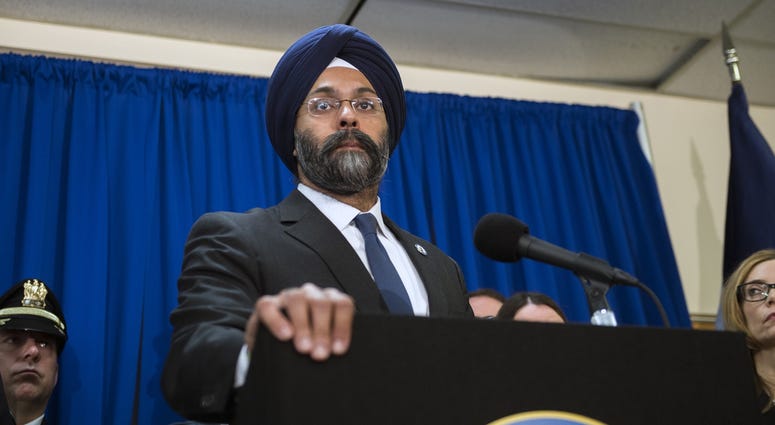 Attorney General Gurbir S. Grewal announces at a press conference on Monday, March 18, 2019 at the Camden County Metro Police Department in Camden, N.J. New Jersey AG Grubir Grewal