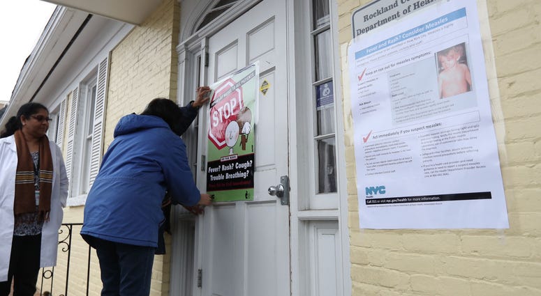 Rockland County Department of Health workers display posters during a measles (MMR) vaccination clinic at WIC Office in Haverstraw on Friday, April 5, 2019. Measles Rockland County