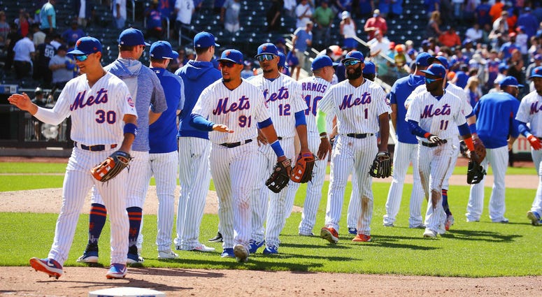 The New York Mets react after defeating the Colorado Rockies at Citi Field. Rockies at New York Mets