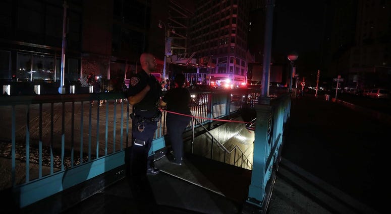 A member of the NYPD stands by a closed subway station at Columbus Circle in Manhattan was closed as subways were shut down after a power outage left large parts of the West Side of Manhattan without power July 13, 2019. NYC Blackout 2019