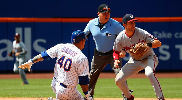New York Mets catcher Wilson Ramos (40) slides safely into second base after hitting a double against the Washington Nationals during the fourth inning at Citi Field. Mets