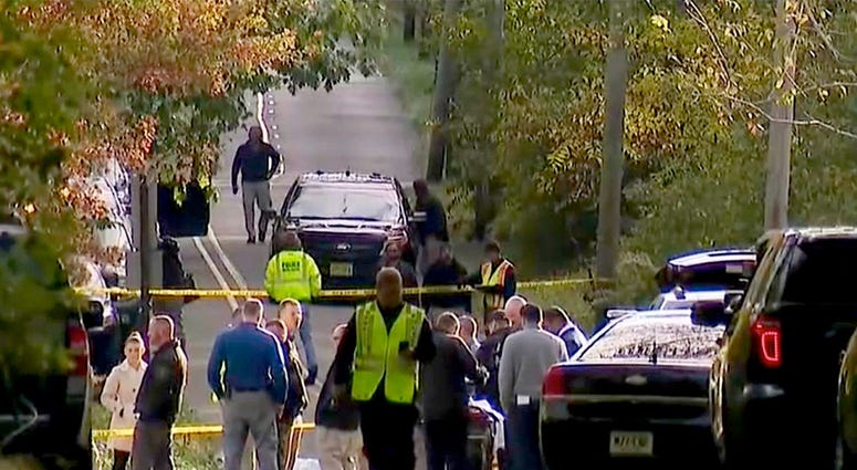 Monmouth County Prosecutors Office and Howell Township police are shown along Hurley Pond Road in the township where a body was found in the roadway Friday morning, October 18, 2019. Howell Township