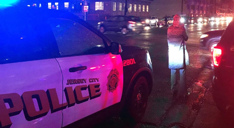 Jersey City Police on the scene after a sprawling gunfight rocked a Jersey City neighborhood on Tuesday, Dec. 10, 2019. Jersey City Police