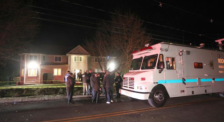 Police work at the home of a rabbi on Forshay Road in Monsey, N.Y. Monsey