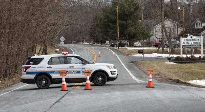 Town of Newburgh police block off a road during an investigation into an early morning shooting that left two adults and one child dead on Sunday, Jan. 26, 2020. Newburgh Police