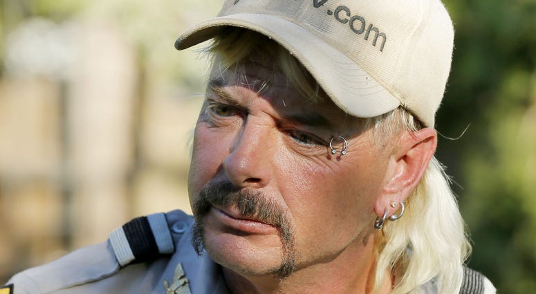 Joseph Maldonado-Passage speaks with the media after giving a statement at the Garold Wayne Interactive Zoological Park, formerly known as the G.W. Exotic Animal Park, in Wynnewood, Okla., Monday, Oct. 7, 2013. Joe Exotic