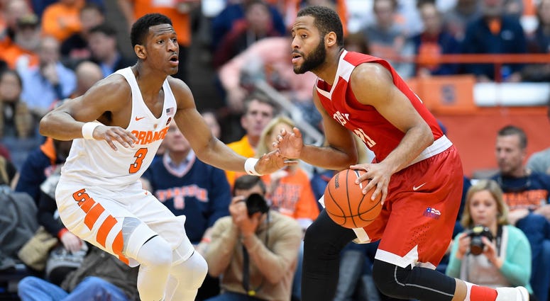 Boston University Terriers guard Cedric Hankerson (21) drives to the basket as Syracuse Orange guard Andrew White III (3) defends during at the Carrier Dome in Syracuse, New York on Dec. 10, 2016. Syracuse University Basketball