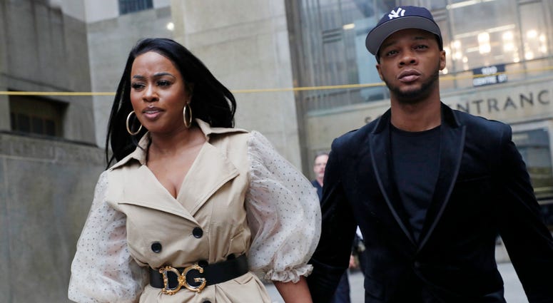Rapper Remy Ma, left, leaves Manhattan Criminal Court, with her husband Papoose, also a rapper, after she was arraigned on a assault charge Wednesday, May 1, 2019, in New York. Remy Ma