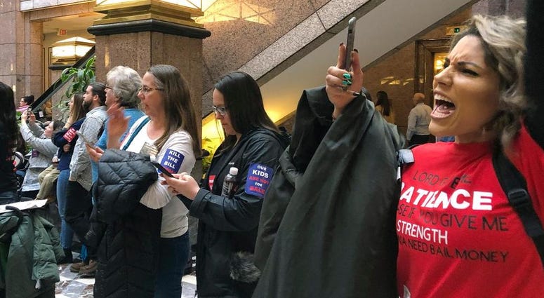 Parents and vaccine skeptics chant "kill the bill" at the Connecticut Legislative Office Building in Hartford on Monday, Feb. 24, 2020. Anti-Vaxxers Rally (AP)