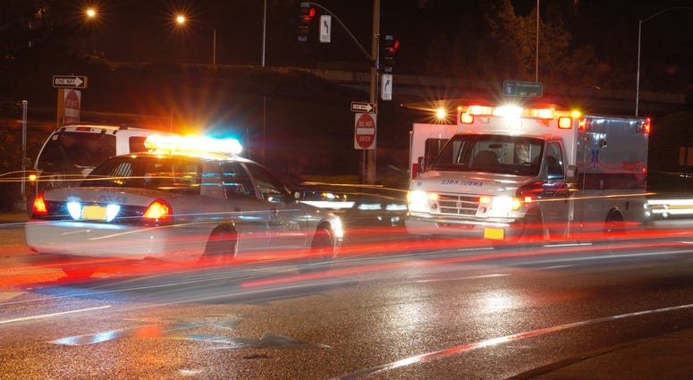 Ambulance and emergency equipment at a motor vehicle accident at night Ambulance