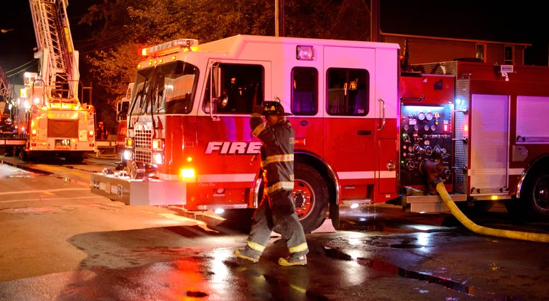 Fire fighters at the scene of a fire Fire Truck Generic