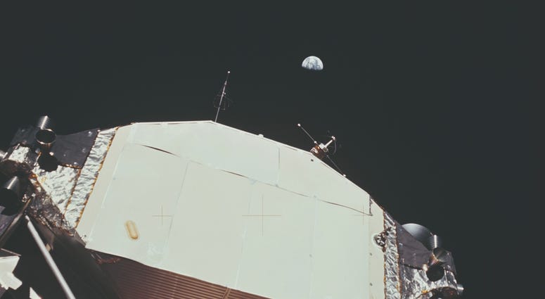 Earth from the Moon The Lunar Module or 'Eagle' on the Moon with the Earth visible behind it.