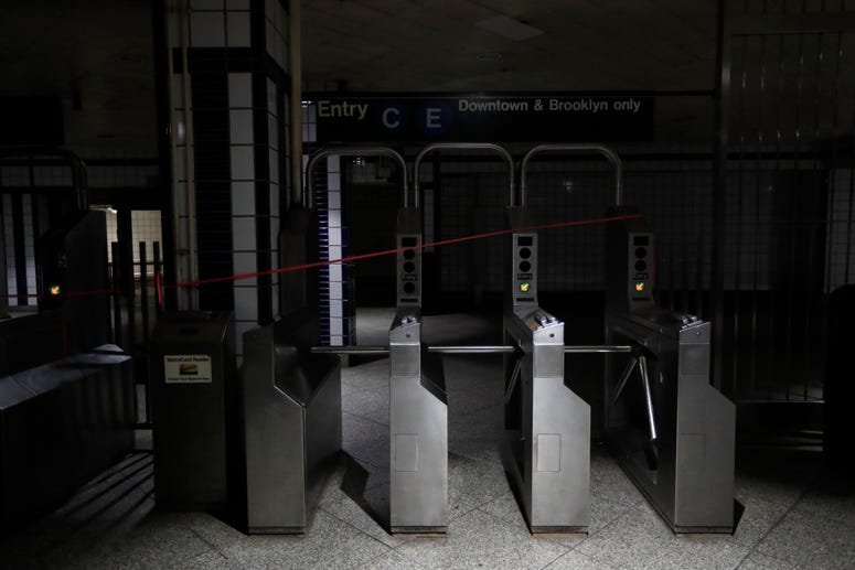 An entrance to the C and E trains at the 50th Street Subway Station is dimly lit during a power outage, Saturday, July 13, 2019, in New York. NYC Blackout AP