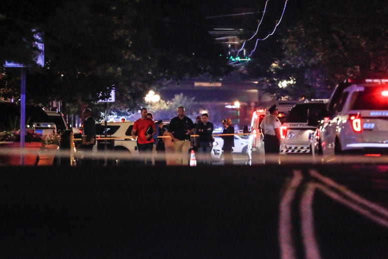 Authorities work the scene of a mass shooting, Sunday, Aug. 4, 2019, in Dayton, Ohio. Dayton shooting