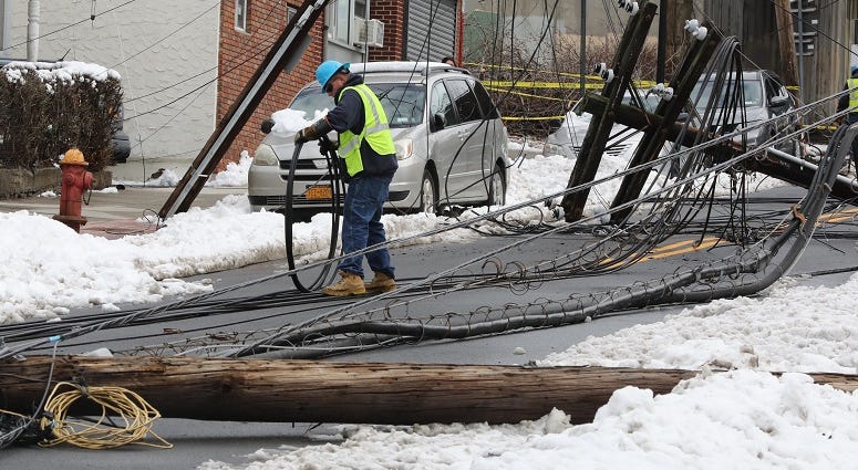Con Edison workers begin their work after utility poles were knocked over along Lockwood Avenue in Yonkers during the nor'easter. Con Edison Crews after nor'easter