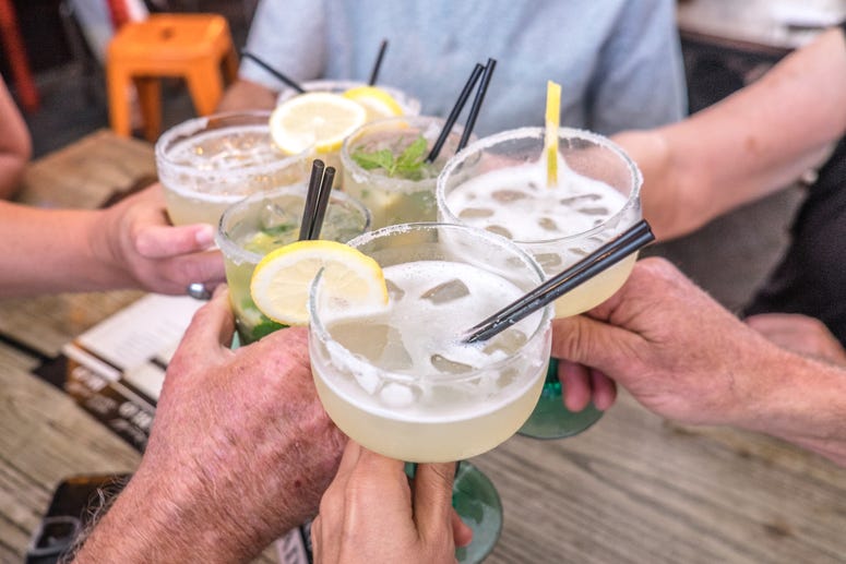 People toasting with margaritas at a celebration. Margaritas