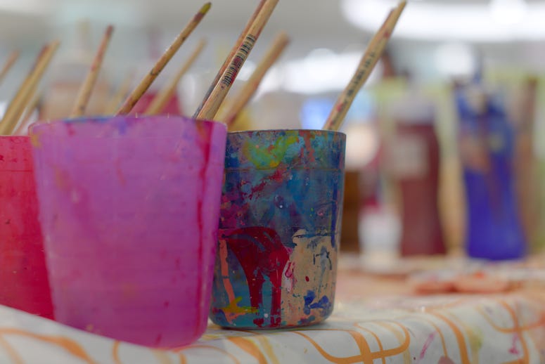 Painting supplies in a classroom setting. Paint Class