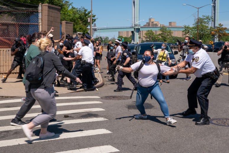 Police confront protesters after taking over the F.D.R. Drive in Harlem on May 30, 2020 in New York City. NYC protest