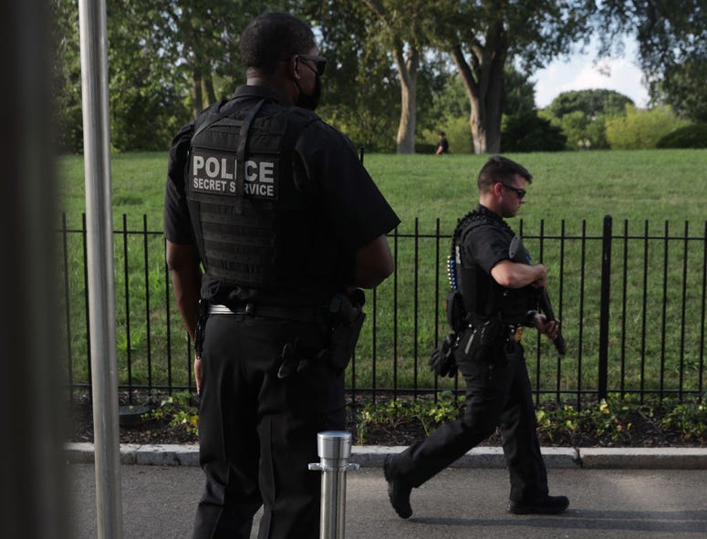 U.S. Secret Service officers stand guard outside of the James Brady Press Briefing Room after shots were reported near the White House August 10, 2020 in Washington, DC. Shooting outside White House