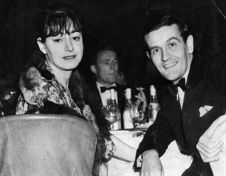 American journalist, writer and wit Dorothy Parker (1893 - 1967), at a restaurant. with her husband, Alan Campbell. Dorothy Parker