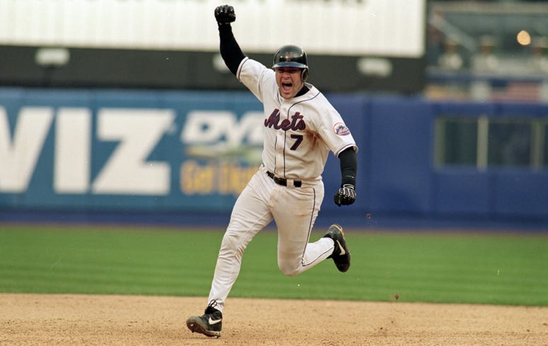 Catcher Todd Pratt #7 of the New York Mets celebrates as he rounds the bases after hitting the game winning home run in the 10 inning during Game Four of the National Lesgue Division Series against the Arizona DiamondBacks at Shea Stadium in Flushing, New Todd Pratt