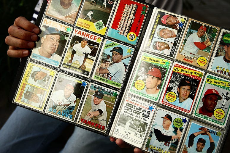 A man sells vintage baseball cards prior to the start of the last game at Yankee Stadium between the Baltimore Orioles and the New York Yankees on September 21, 2008 at Yankee Stadium in the Bronx borough of New York City. Baseball Cards