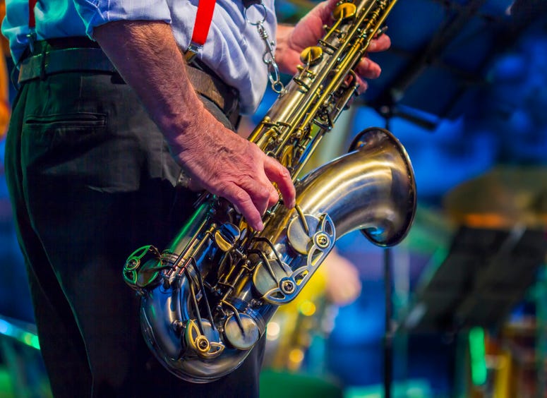 A saxophone player performing on stage. Jazz