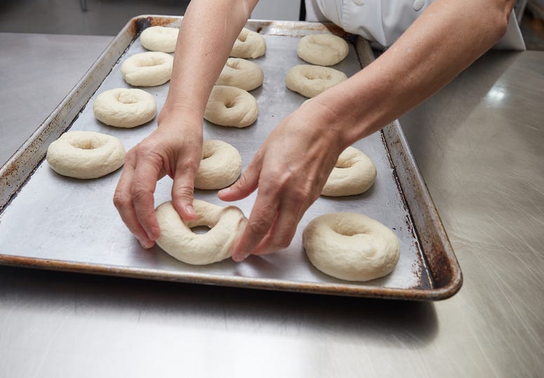 Baker making a bagel. Bagel Making
