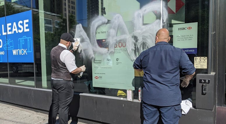 Graffiti on HSBC Bank in Union Square after protests Cleanup in Union Square