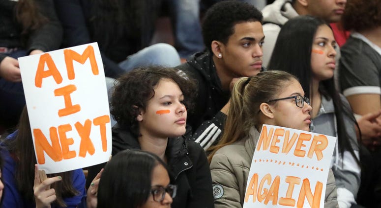 Ninth grade students Nicole McKenna, Rebecca Medina and Thalia Dillon join their classmates at Lincoln High School in Yonkers, who join in the National School Walkout during the rally against gun violence. National Walkout Day
