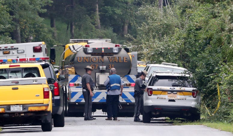 New York State police and FAA representatives continue their investigation at the scene on South Smith Road in Union Vale where a plane crashed into a house on Saturday Aug. 17, 2019. Dutchess crash
