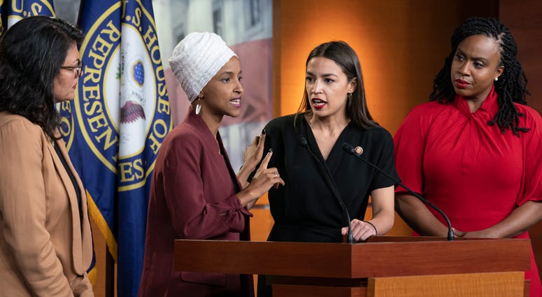 From left, Rep. Rashida Tlaib, D-Mich., Rep. Ilhan Omar, D-Minn., Rep. Alexandria Ocasio-Cortez, D-N.Y., and Rep. Ayanna Pressley, D-Mass., respond to remarks by President Donald Trump during a news conference in Washington, Monday, July 15, 2019. Dems 'The Squad'