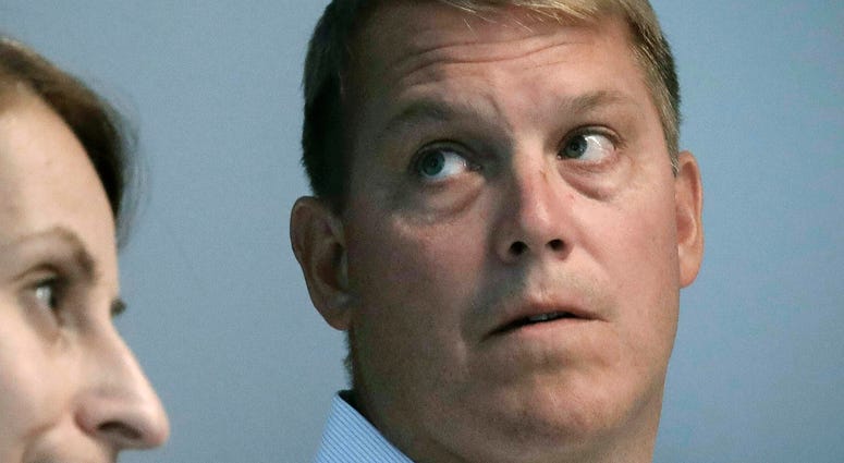 In this Aug. 20, 2019 file photo, Scott Hapgood, right, a U.S. financial adviser charged with killing a hotel worker while on vacation in Anguilla, and his lawyer Juliya Arbisman, left, hold a media conference in New York. Scott Hapgood