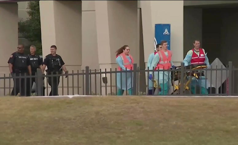 This photo taken from video provided by WEAR-TV shows emergency responders near the Naval Air Base Station in Pensacola, Fla., Friday, Dec. 6, 2019. Pensacola shooting