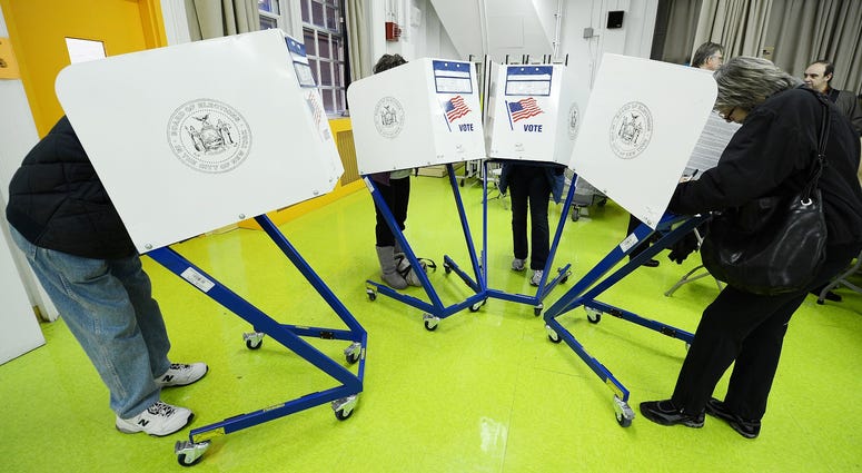Residents cast their ballots to vote in the 2012 General Election at Yorkville Community School located on 421 East 88th Street on the Upper East Side of Manhattan NYC Election Day