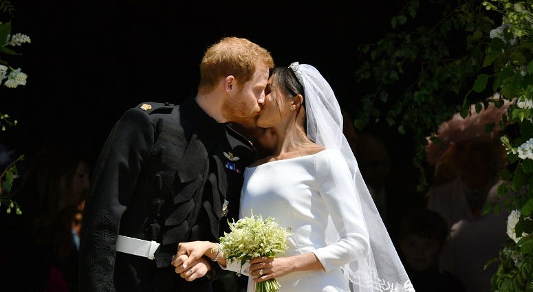 Prince Harry and Meghan Markle kiss as they leave St George's Chapel in Windsor Castle after their wedding. The Royal Wedding