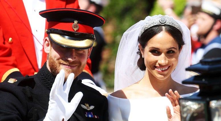 Prince Harry and Meghan Markle ride in an open-topped carriage through Windsor after their wedding in St George's Chapel. The Royal Wedding