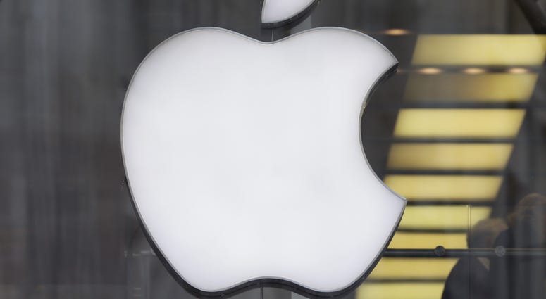 File photo dated 28/01/15 of the Apple logo in the window of a store. Apple Logo