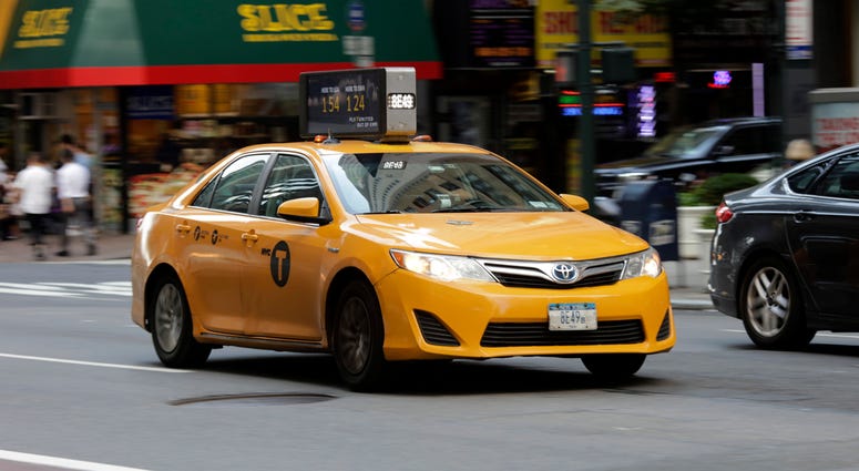 A yellow cab is seen on a street in Manhattan, New York City, the United States, Aug. 9, 2018. Yellow Taxi