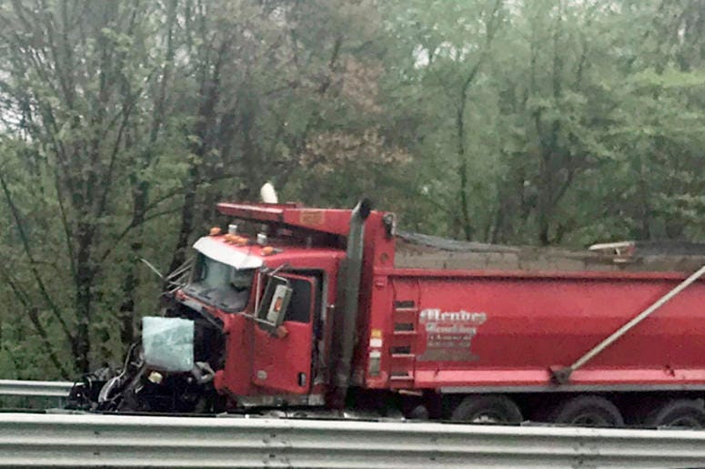 A dump truck sits near the scene after a collision with a school bus in Mount Olive, N.J., Thursday, May 17, 2018. Deadly New Jersey School Bus Crash