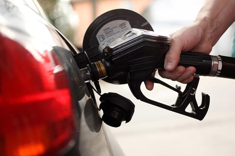 A gasoline station attendant pumps diesel into a car at a filling station on March 23, 2010 in Berlin, Germany. Gas Pump