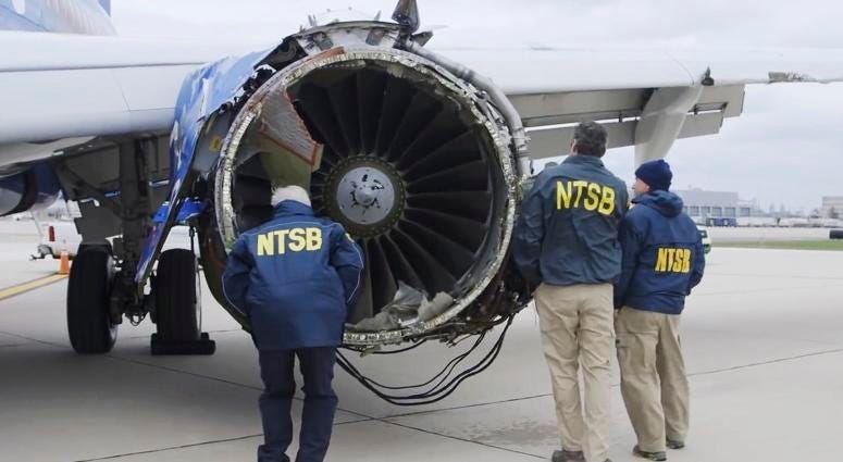 In this Tuesday, April 17, 2018 frame from video, a National Transportation Safety Board investigator examines damage to the engine of the Southwest Airlines plane that made an emergency landing at Philadelphia International Airport in Philadelphia. Southwest Airlines Emergency Landing