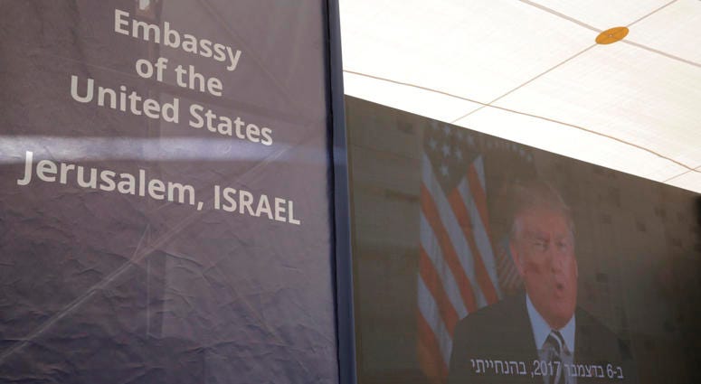 U.S. President Donald Trump is seen on screen as he delivers his speech during the opening ceremony of the new U.S. embassy in Jerusalem, Monday, May 14, 2018. U.S. embassy in Jerusalem
