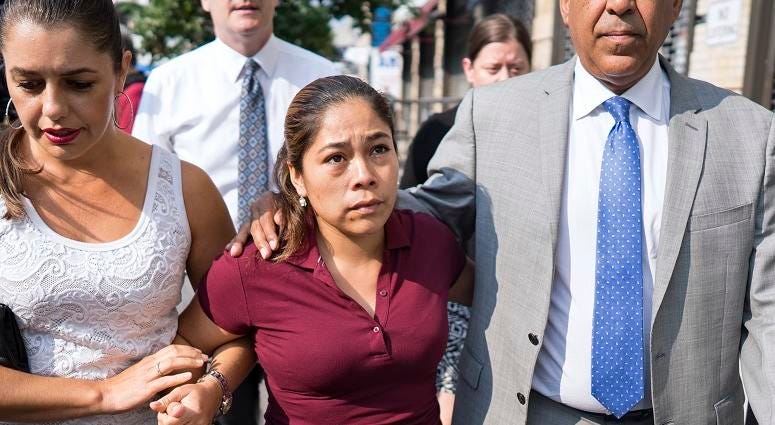 Yeni Gonzalez, center, a Guatemalan mother who was separated from her three children at the U.S.-Mexico border arrives Tuesday, July 3, 2108 to reunite with them in New York. Yeni Gonzalez