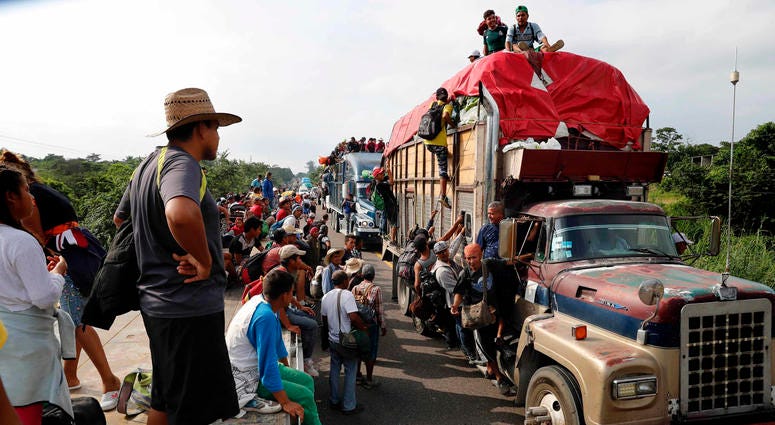 entral American migrants, part of the caravan hoping to reach the U.S. border, get a ride on trucks, in Donaji, Oaxaca state, Mexico, Friday, Nov. 2, 2018. migrant caravan
