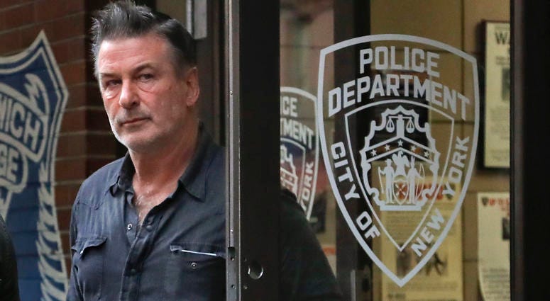 Actor Alec Baldwin walks out of the New York Police Department's 10th Precinct, Friday, Nov. 2, 2018, in New York. Baldwin was arrested Friday after allegedly punching a man in the face during a dispute over a parking spot outside his New York City home, alec baldwin punch arrest