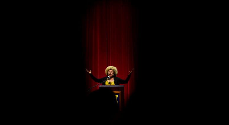 In this Feb. 19, 2015, file photo Angela Davis, author, educator and iconic civil rights activist, speaks during her visit to the University of Michigan-Flint, in Flint, Mich. Angela Davis